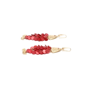 Detail of handmade red fish drop earrings with layered scales and gold hook