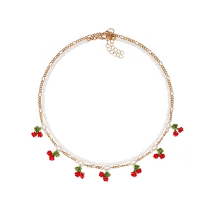 Double-layered beaded necklace featuring handmade red cherry charms and white pearls