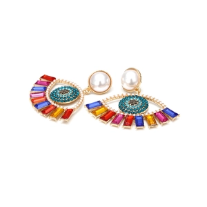 Exaggerated devil's eye drop earrings with colorful crystals and pearl accents