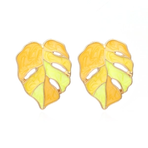 Green and yellow monstera leaf enamel earrings with gold plating on white background