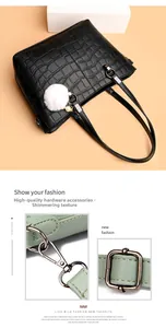 Detail of premium crocodile pattern leather bag with gunmetal lobster clasp and hardware
