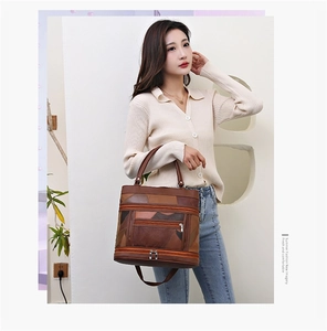 Brown patchwork leather tote bag with multiple zip pockets and adjustable strap for women