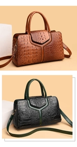 Detailed close-up showing embossed crocodile texture and metal buckles on handbags