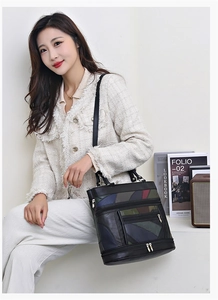 Detailed view of vintage patchwork leather handbag with multi-zipper and shoulder strap
