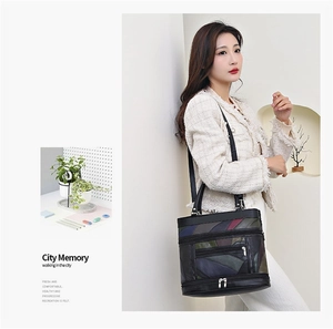 Detail view of multi-color patchwork soft leather tote bag with several functional zippers