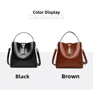 Detail view of large capacity bucket bags in black and brown with chain metal buckles