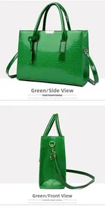 Detail of green crocodile embossed tote bag with gold hardware and removable shoulder strap