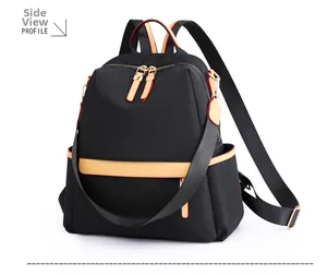 Side view of black nylon backpack with yellow leather accents and golden zippers