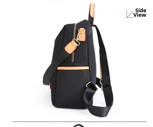 Side view of black water-resistant nylon backpack with gold-tone metal hardware details