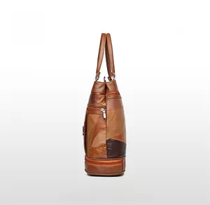Side view of vintage patchwork tote bag showing brown leather panels and zipper detail