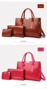Three-piece women's set with crocodile pattern tote, clutch, and wallet in brown and pink