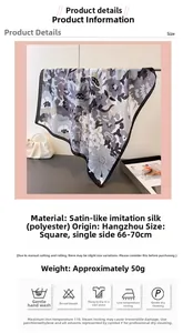 Detail eines floral bedruckten Satin-Halstuchs mit grauen Blumen und Seidentextur