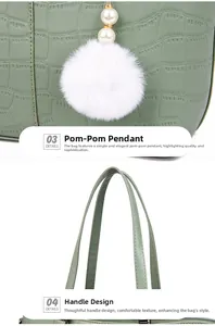 Detail view of grass green bucket bag with crocodile texture, pearl and fur ball charm