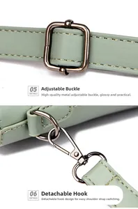 Close-up of sage green leather bag with adjustable strap and dark metal buckle hardware