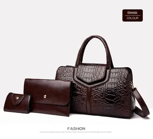 Three-piece brown crocodile embossed handbag set with large tote and matching wallets