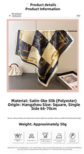 Detail of luxury silk-like scarf featuring classic belt and chain print patterns
