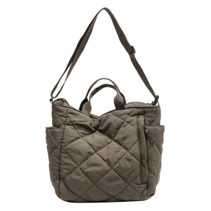 Quilted tote bag in olive brown nylon with adjustable strap for versatile daily wear