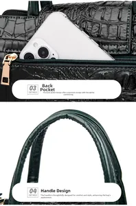 Detail view of crocodile pattern handbag with rear zipper pocket and curved handles