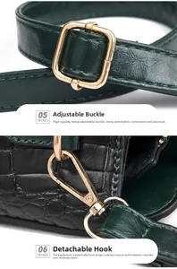 Detail view of crocodile pattern leather with gold adjustable buckle and detachable hook