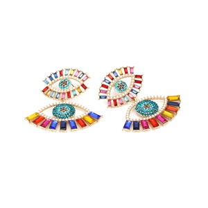 Colorful rhinestone evil eye drop earrings with a golden alloy base in a flat lay view