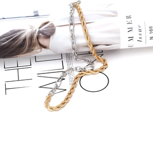 Two-tone gold and silver chain link necklace with industrial OT toggle clasp design