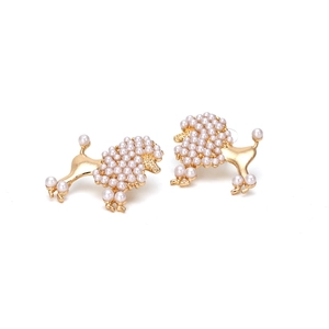 Detail of gold alloy poodle stud earrings with white faux pearl embellishments