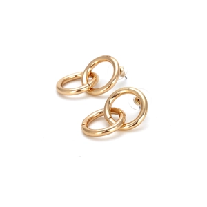Detailed close-up of gold geometric interlocking hoop earrings with secure silicone backings