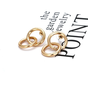 Polished gold double hoop interlocking earrings with geometric minimalist design