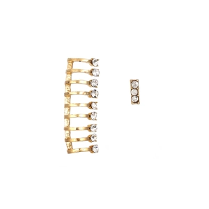 Detail of multi-layer gold ear cuff and rectangular stud earrings with clear crystals