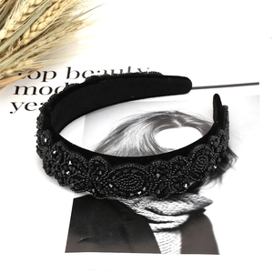 Luxurious velvet headband with hand-sewn black beads and crystals in a vintage style