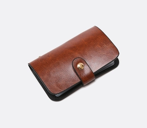 Brown vintage faux leather card holder with gold snap button and multi-layer slots