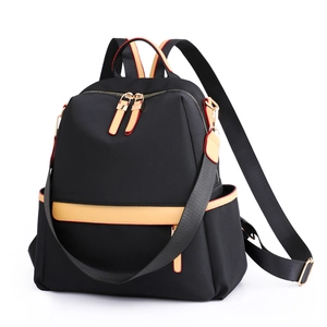Fashionable black waterproof nylon backpack for women with yellow leather trim accents