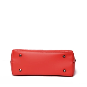 Red bucket bag bottom with embossed stone texture and protective metal rivets
