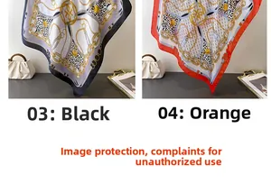 Close-up of elegant chain and leopard print silk scarves in black and orange patterns