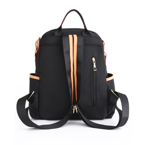 Waterproof black nylon backpack for women with anti-theft back pocket and gold hardware