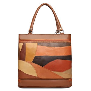 Vintage patchwork leather tote bag with brown and beige tones and round top handles