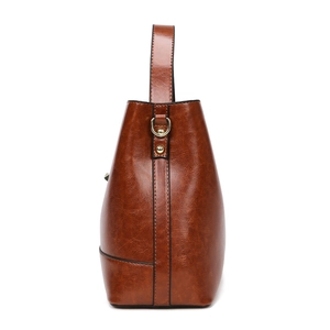 Dark brown faux leather bucket bag with vintage finish and golden hardware details