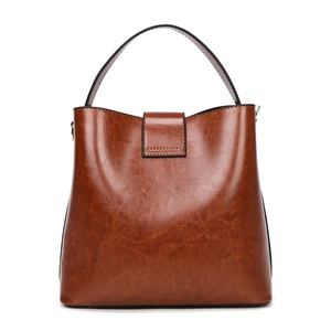 Retro caramel brown PU leather bucket bag with top handle and metal D-ring attachment