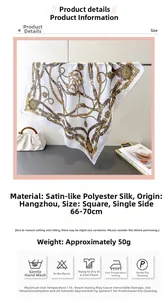 Detail showing vintage gold chain and medal print on silky satin square scarf fabric