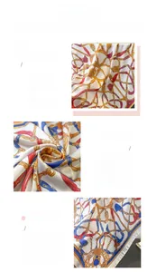 Macro detail of silk-like scarf showing vintage chain print and precise stitched edges