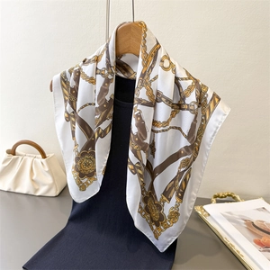 Luxury vintage silk scarf featuring gold chains and equestrian prints on cream fabric