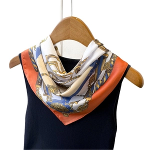 Retro silk-like square scarf with horse chain print on a wooden hanger with black top