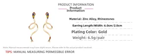 Détail des boucles d'oreilles serpent dorées avec strass incluant taille et poids précis