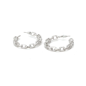 Detailed close-up of chunky silver C-shape chain link earrings with butterfly backs