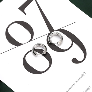 Polished silver chunky hoop earrings in minimalist geometric style for women