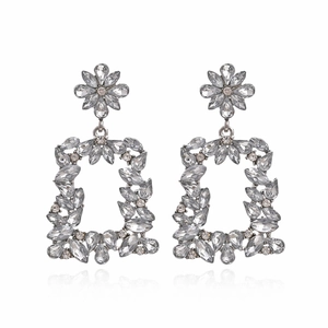 Exaggerated geometric flower earrings with sparkling rhinestones in a silver-toned setting