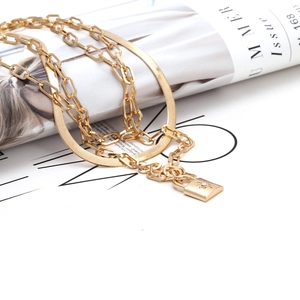 Chic gold-plated layered necklace set with a starburst engraved padlock pendant