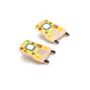 Creative yellow bus earrings in alloy with colorful rhinestones on a white background