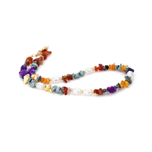 Handmade necklace with multicolor natural crushed stones and pearls on white background
