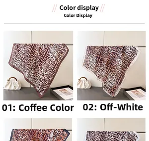 Close-up of leopard print silk scarves in coffee and off-white with hemmed edges